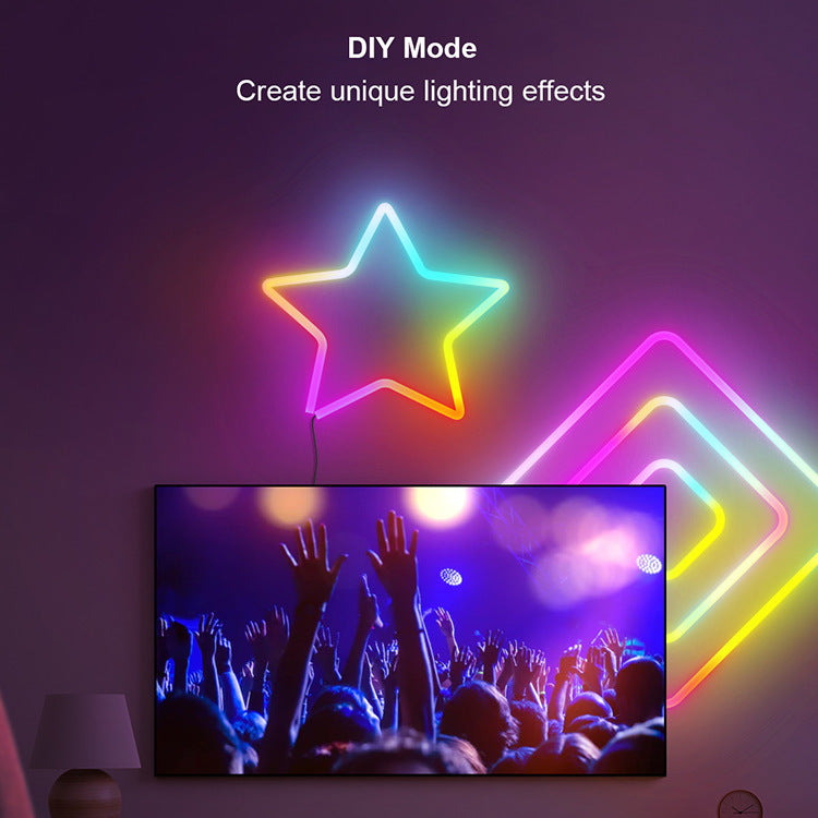 Neon star light fixture with colorful design above a TV displaying a concert scene.