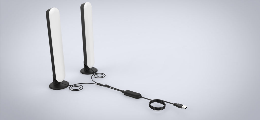 Two white antennas with a black cable on a light gray background